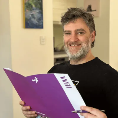 Couple reviewing their Will Hero documents before travelling overseas